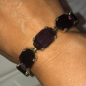 Purple stone and gold colored bracelet